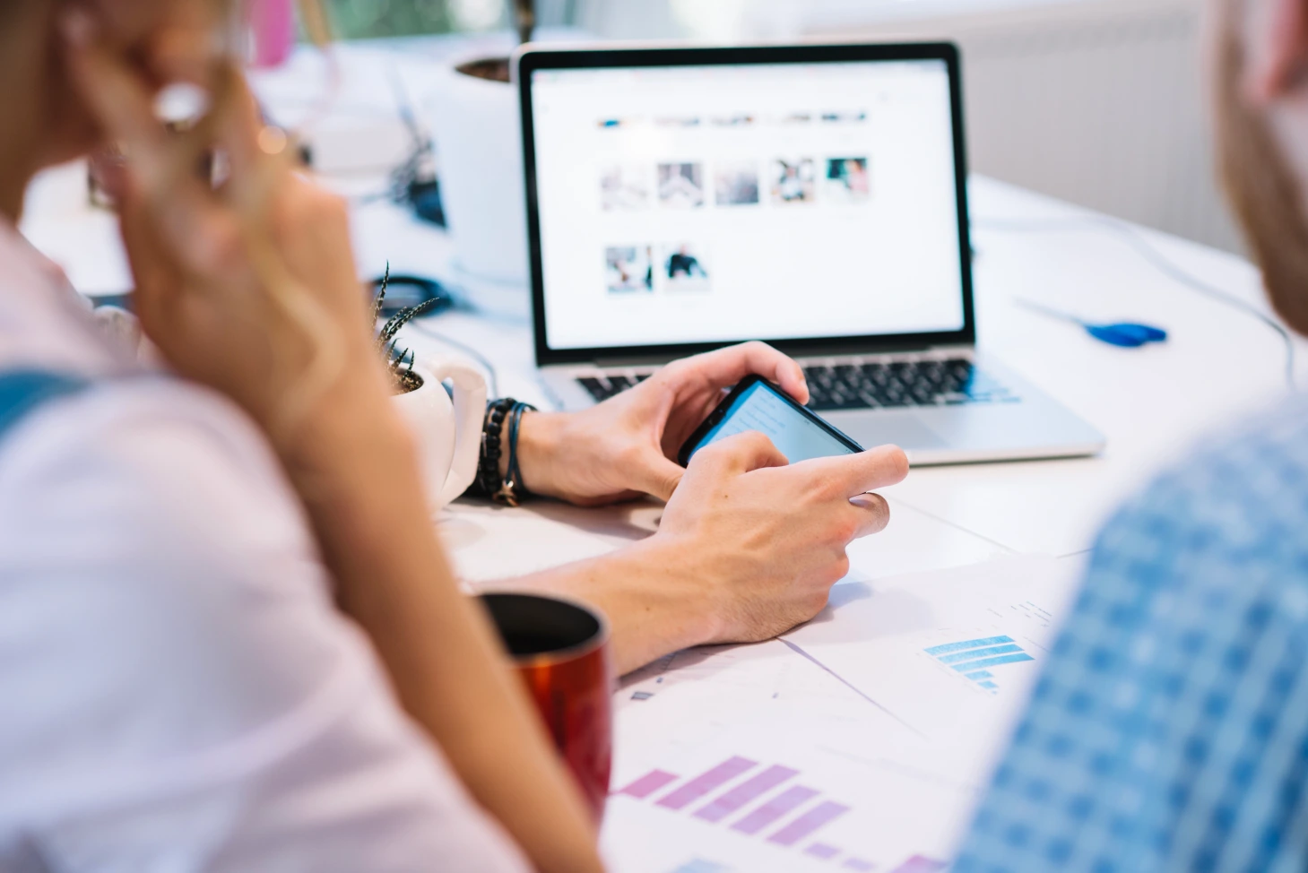 people-working-with-smartphone-laptop (1) B2B Website Strategy