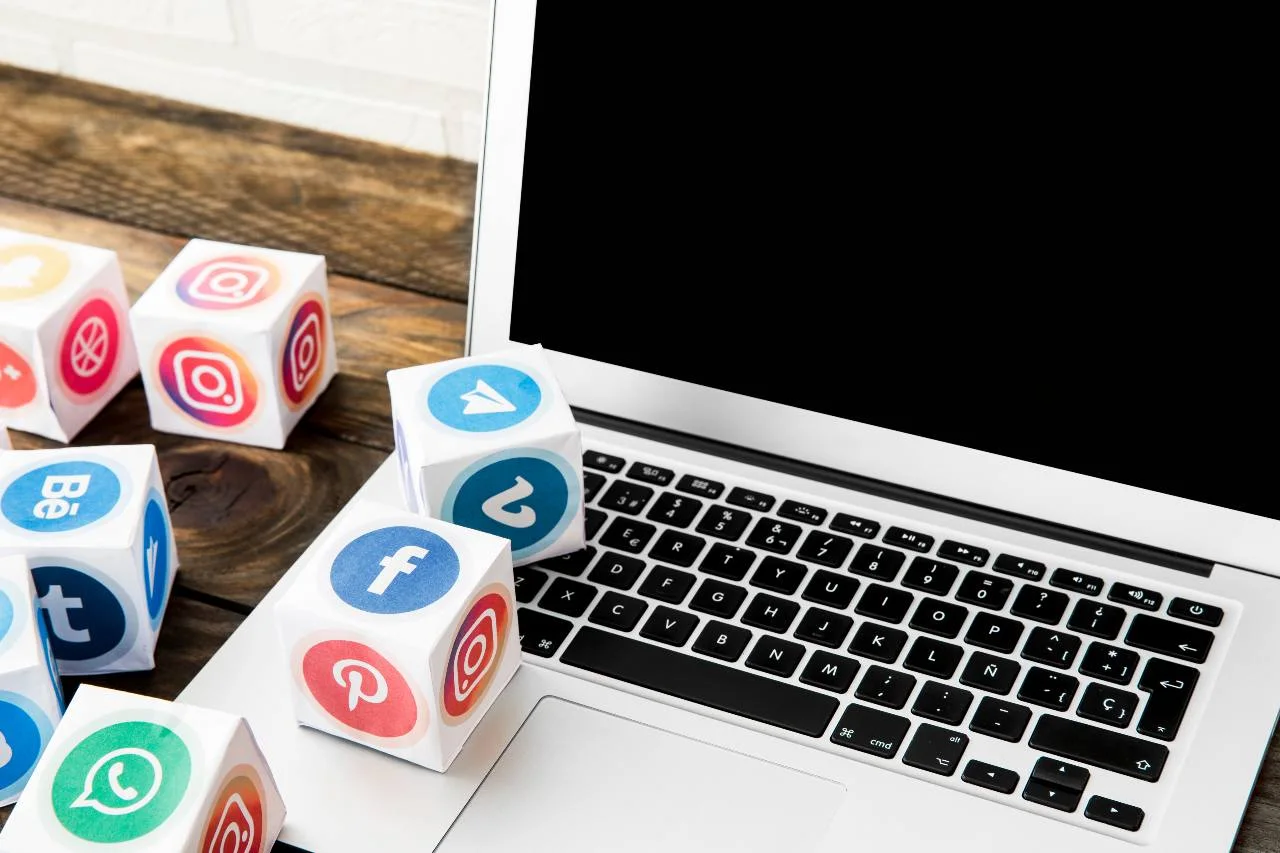 social media icons on top of laptop