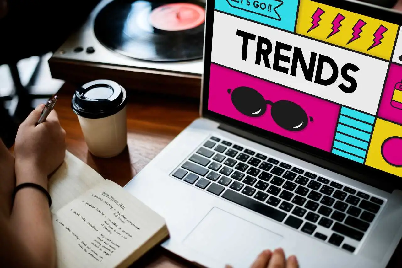 emerging-marketing-trends person searching marketing trends on laptop