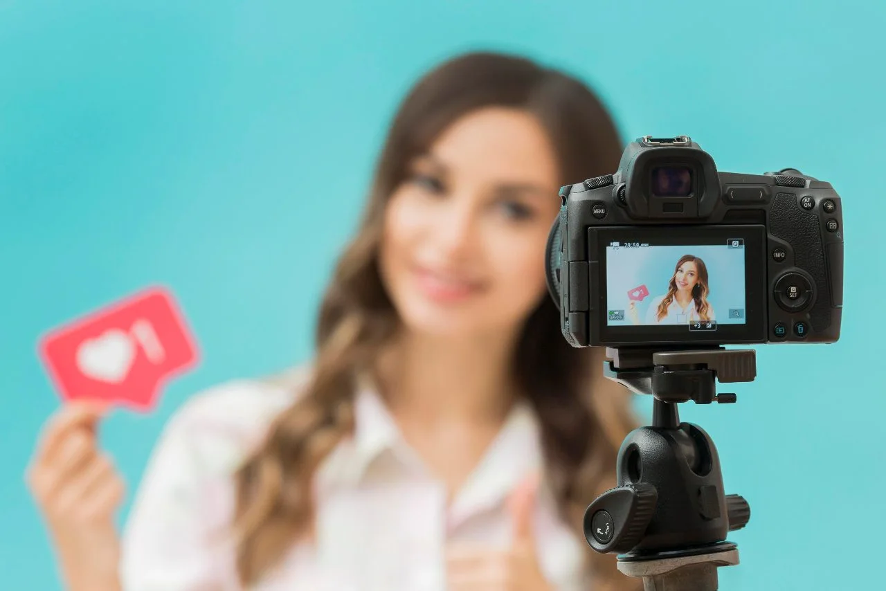 A person filming video content for marketing