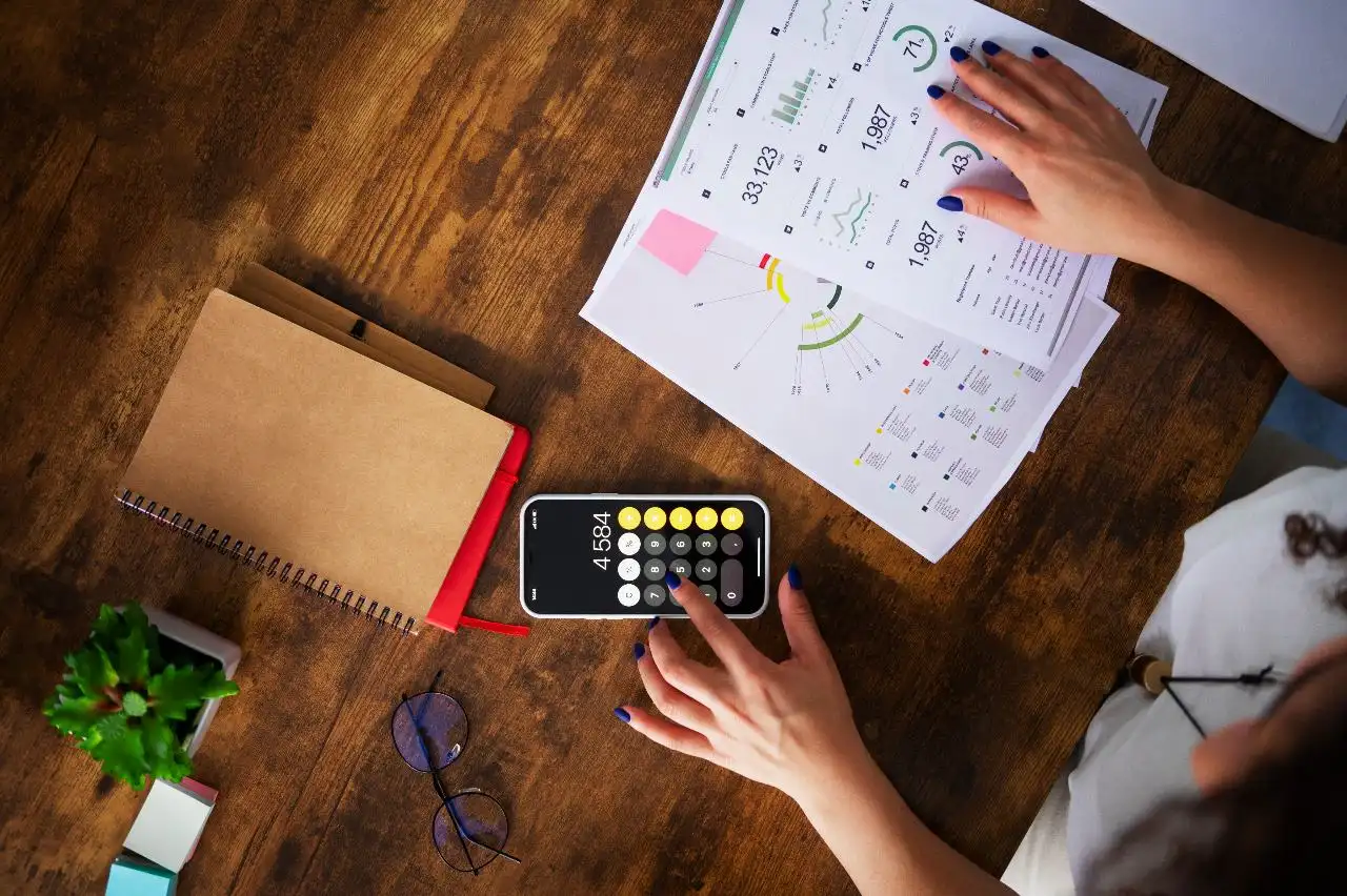 person calculating marketing budget