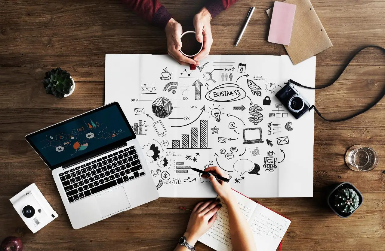 marketing map lying near laptop