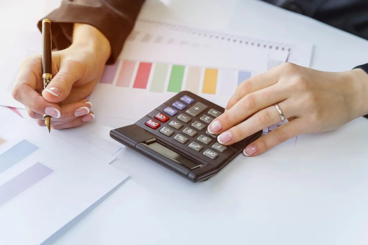 hands using a calculator