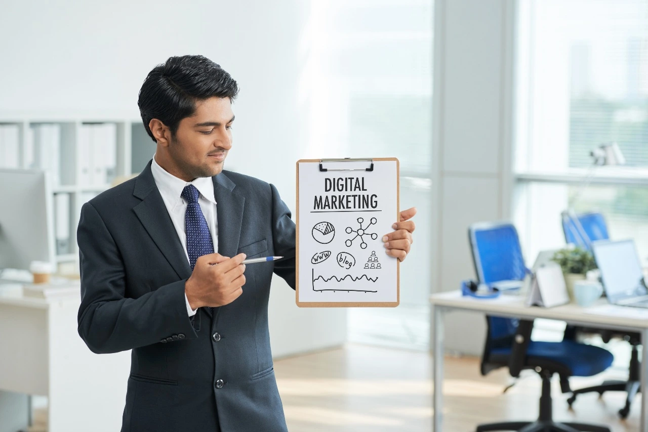 man standing and pointing to digital marketing poster